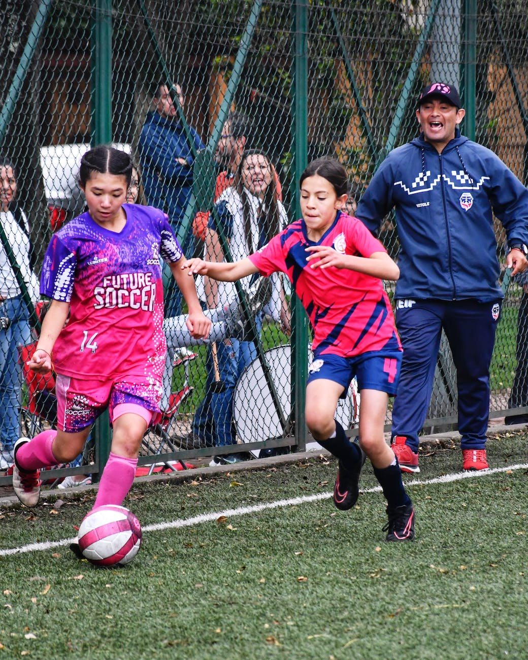 girls football match coach instruct for correct decision making in football